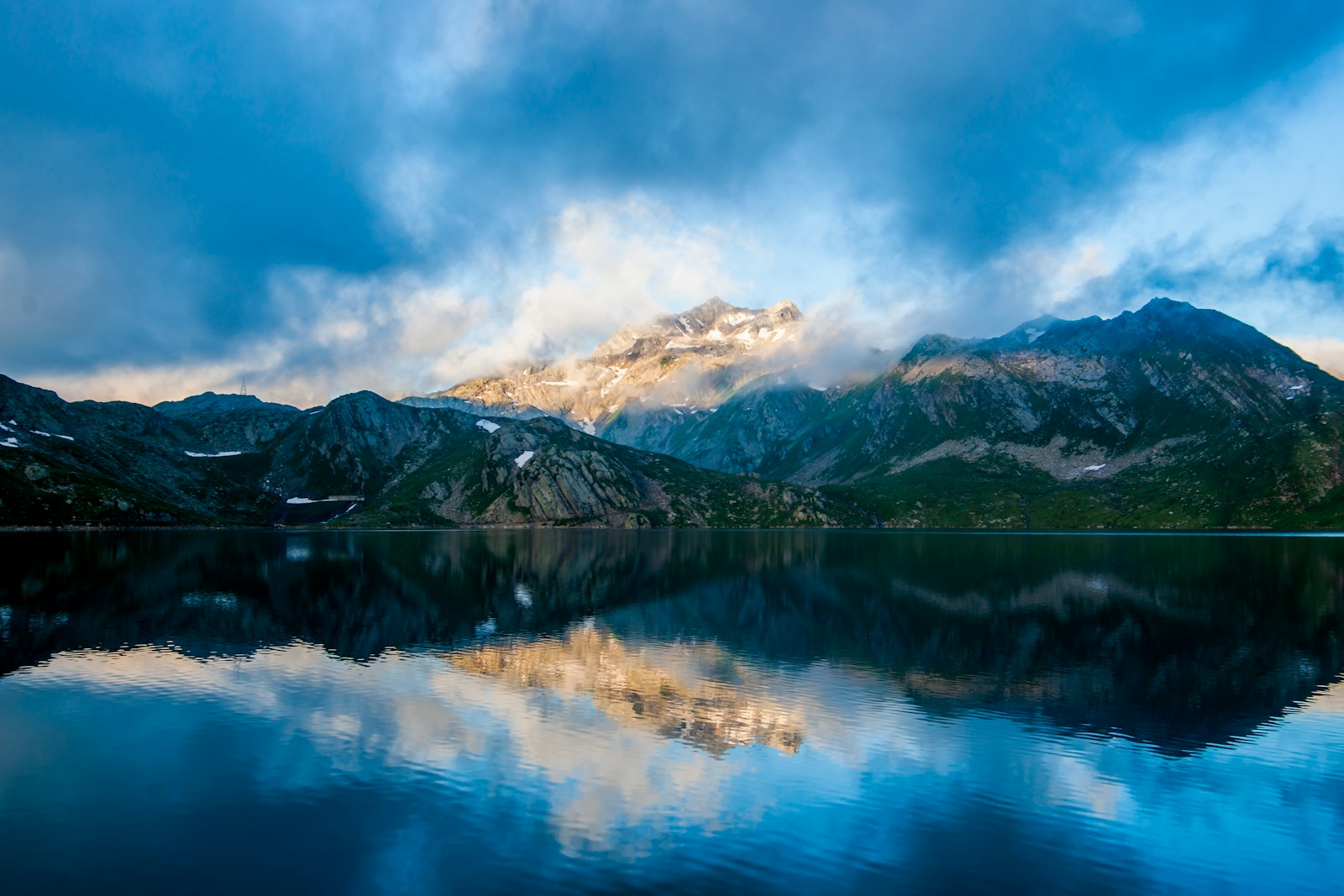 Photo by Alberto Restifo parorama photography of mountain under cloudy sky